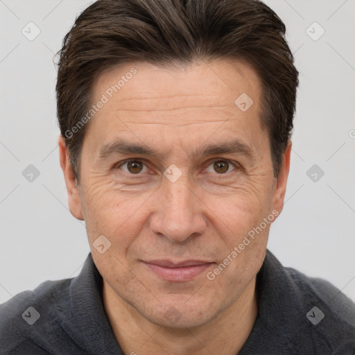 Joyful white adult male with short  brown hair and brown eyes