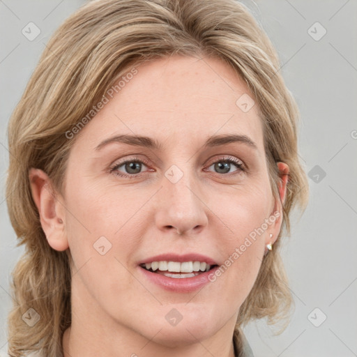 Joyful white young-adult female with medium  brown hair and blue eyes