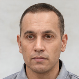Neutral white adult male with short  black hair and brown eyes