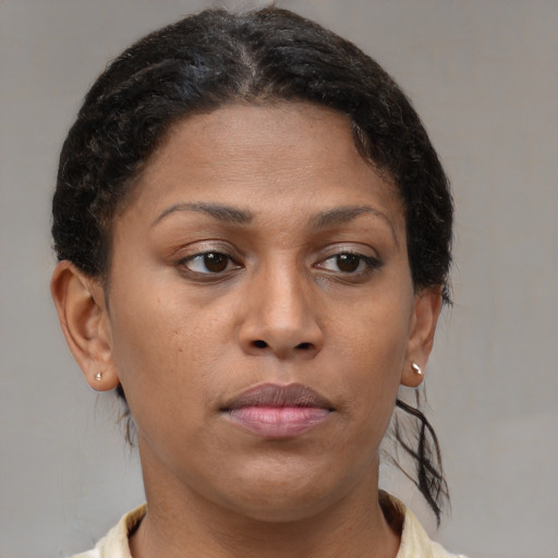 Neutral black young-adult female with short  brown hair and brown eyes