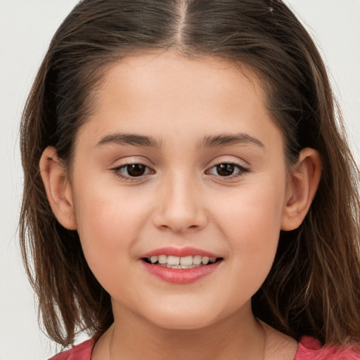 Joyful white child female with long  brown hair and brown eyes