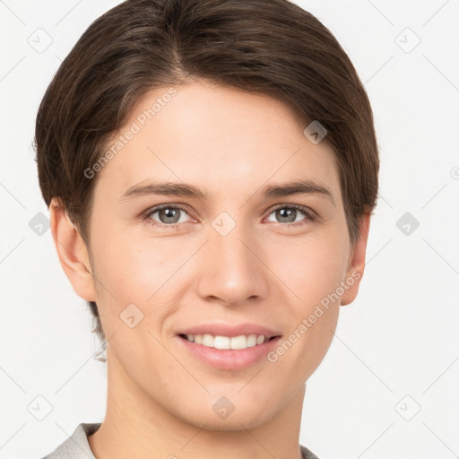 Joyful white young-adult female with short  brown hair and grey eyes