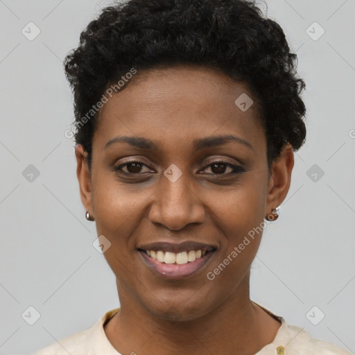 Joyful black young-adult female with short  black hair and brown eyes