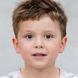 Joyful white child male with short  brown hair and brown eyes