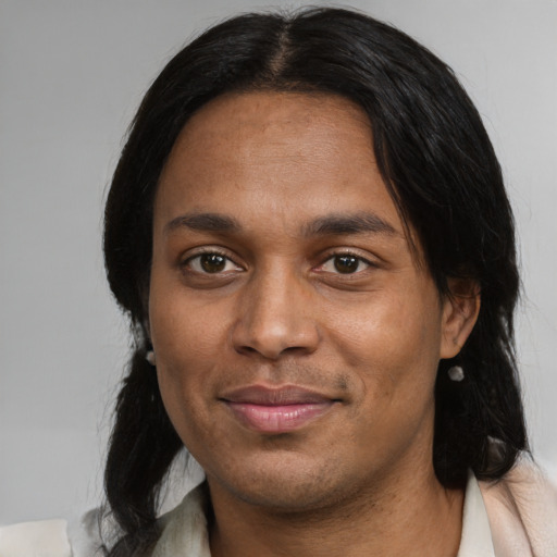 Joyful black adult male with medium  black hair and brown eyes