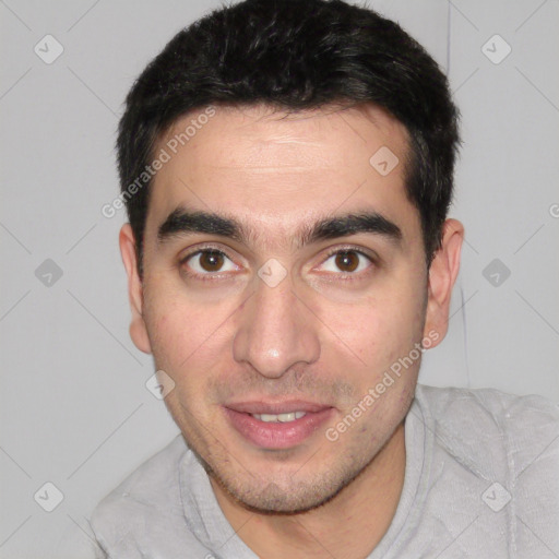 Joyful white young-adult male with short  black hair and brown eyes