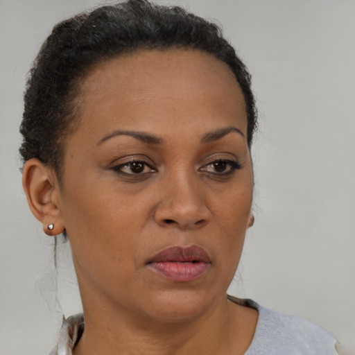 Neutral black young-adult female with short  brown hair and brown eyes