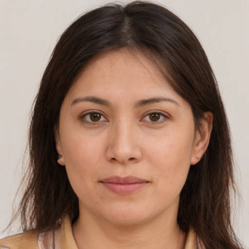 Joyful white young-adult female with long  brown hair and brown eyes