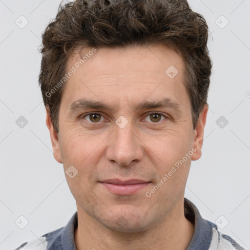 Joyful white adult male with short  brown hair and grey eyes