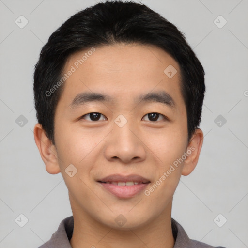 Joyful asian young-adult male with short  black hair and brown eyes