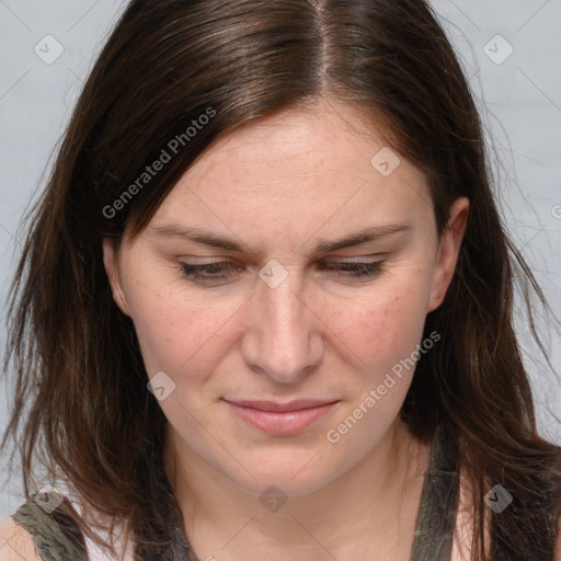 Joyful white adult female with long  brown hair and brown eyes