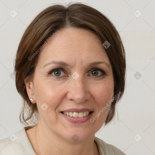 Joyful white adult female with medium  brown hair and grey eyes