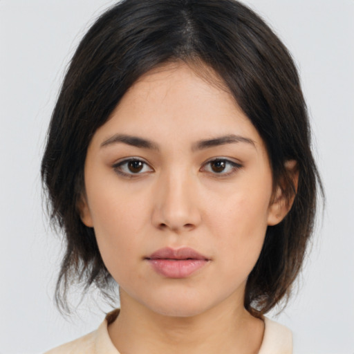 Neutral asian young-adult female with medium  brown hair and brown eyes
