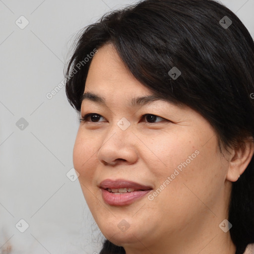 Joyful white adult female with medium  brown hair and brown eyes