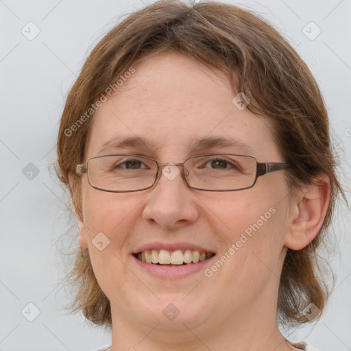 Joyful white adult female with medium  brown hair and brown eyes