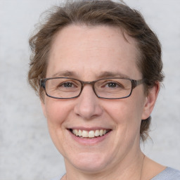 Joyful white adult female with short  brown hair and brown eyes