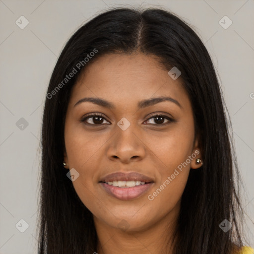 Joyful black young-adult female with long  brown hair and brown eyes