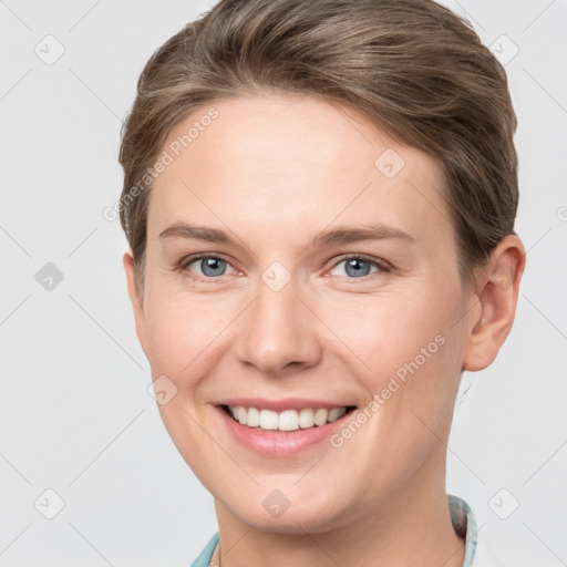 Joyful white young-adult female with short  brown hair and grey eyes