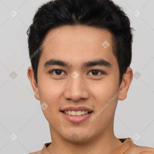 Joyful latino young-adult male with short  brown hair and brown eyes