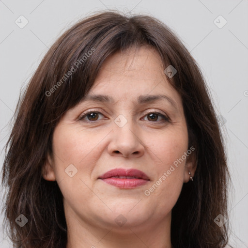 Joyful white adult female with medium  brown hair and grey eyes