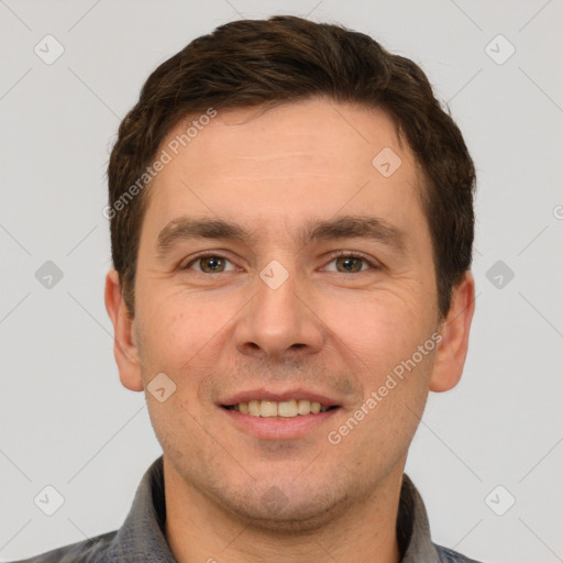 Joyful white adult male with short  brown hair and grey eyes