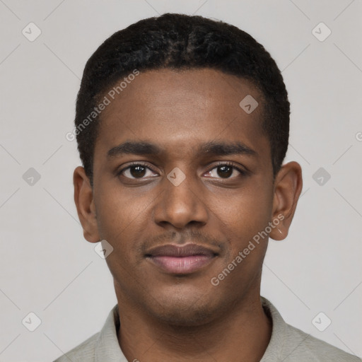 Joyful black young-adult male with short  black hair and brown eyes