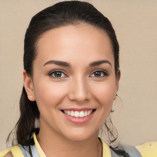 Joyful white young-adult female with medium  brown hair and brown eyes