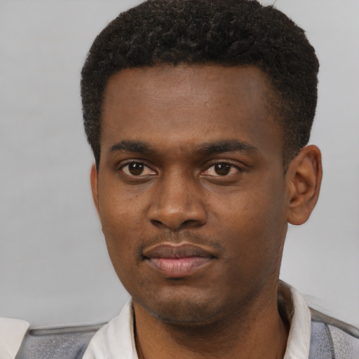 Neutral black young-adult male with short  black hair and brown eyes