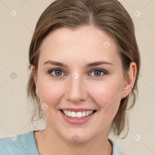 Joyful white young-adult female with medium  brown hair and blue eyes