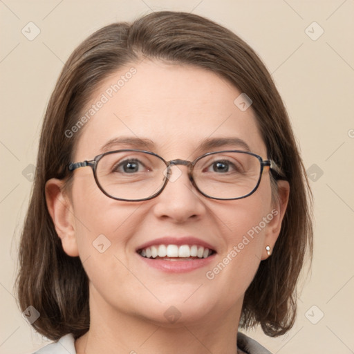 Joyful white adult female with medium  brown hair and grey eyes