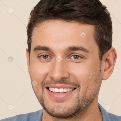 Joyful white young-adult male with short  brown hair and brown eyes