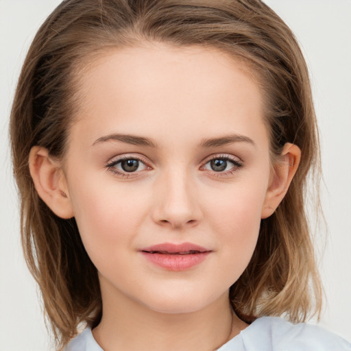 Joyful white child female with medium  brown hair and grey eyes