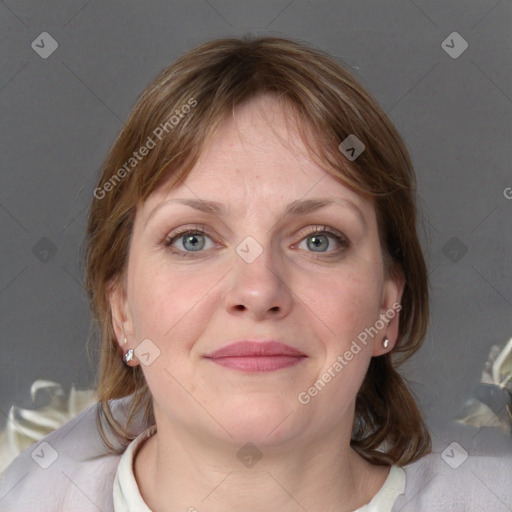 Joyful white adult female with medium  brown hair and blue eyes