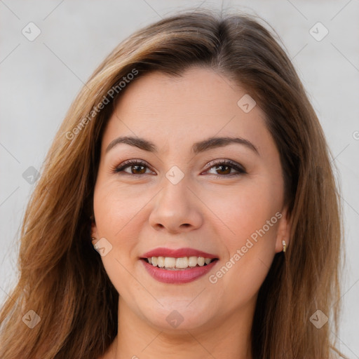 Joyful white young-adult female with long  brown hair and brown eyes