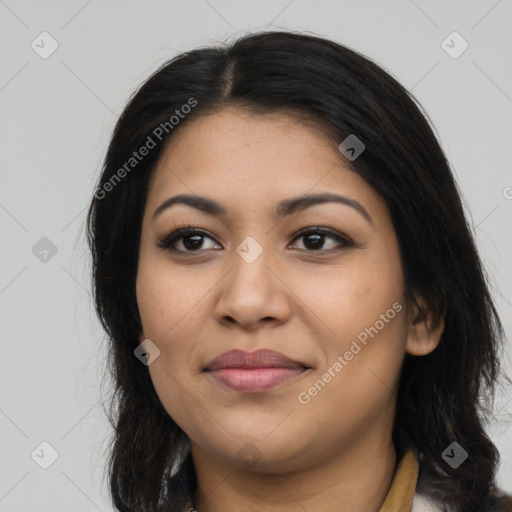 Joyful latino young-adult female with long  brown hair and brown eyes