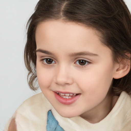 Joyful white child female with medium  brown hair and brown eyes