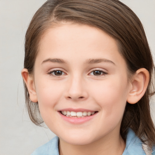 Joyful white child female with medium  brown hair and brown eyes