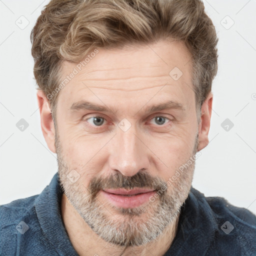 Joyful white adult male with short  brown hair and grey eyes