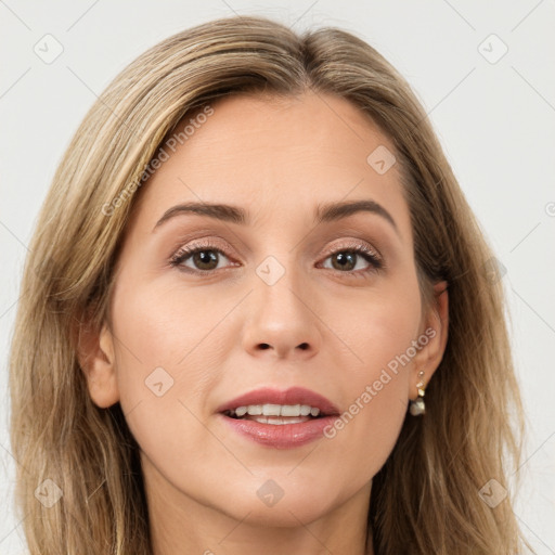 Joyful white young-adult female with long  brown hair and brown eyes