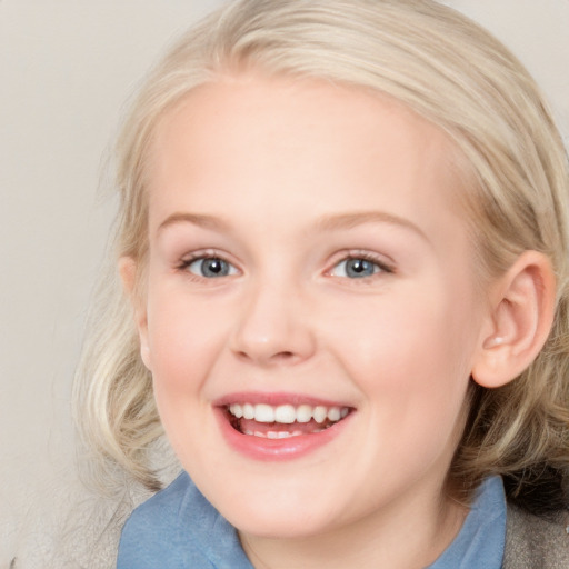 Joyful white young-adult female with medium  blond hair and blue eyes