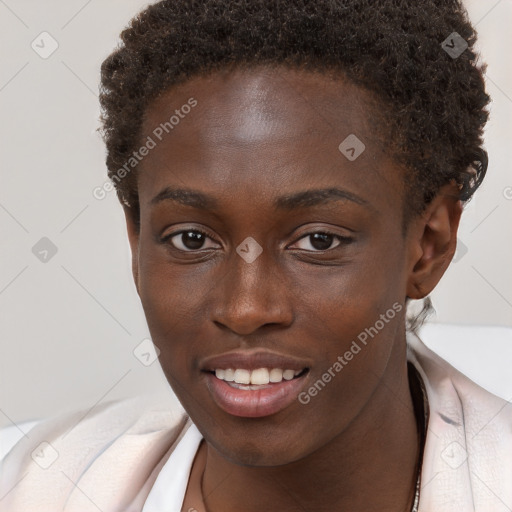 Joyful black young-adult female with short  brown hair and brown eyes