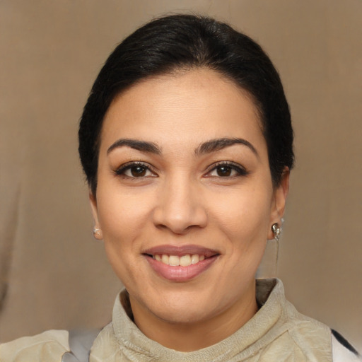 Joyful latino young-adult female with short  brown hair and brown eyes