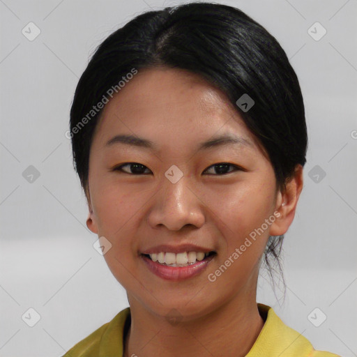 Joyful asian young-adult female with short  black hair and brown eyes