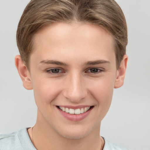 Joyful white young-adult female with short  brown hair and grey eyes