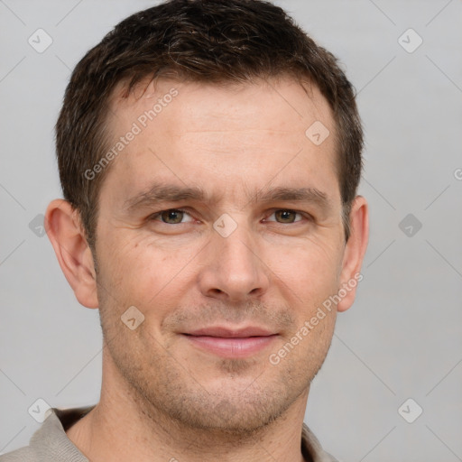 Joyful white adult male with short  brown hair and brown eyes