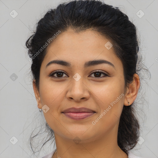 Joyful latino young-adult female with long  brown hair and brown eyes