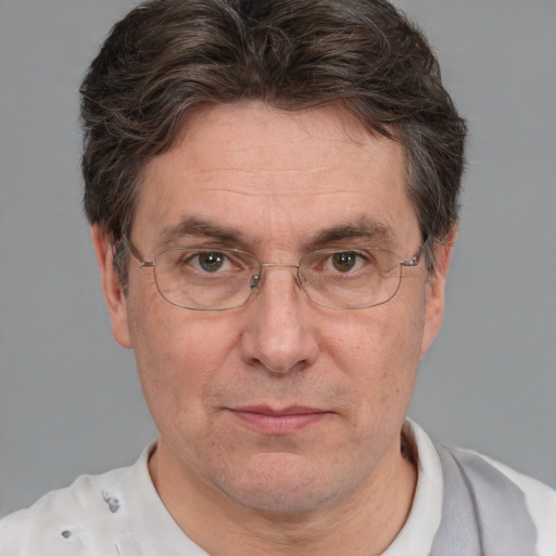 Joyful white middle-aged male with short  brown hair and brown eyes