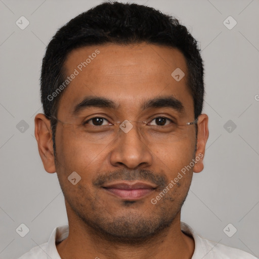 Joyful latino young-adult male with short  black hair and brown eyes