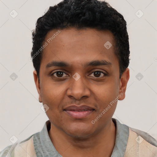 Joyful black young-adult male with short  black hair and brown eyes