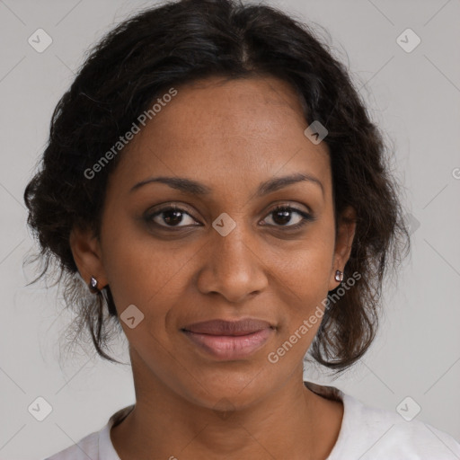 Joyful black adult female with medium  brown hair and brown eyes